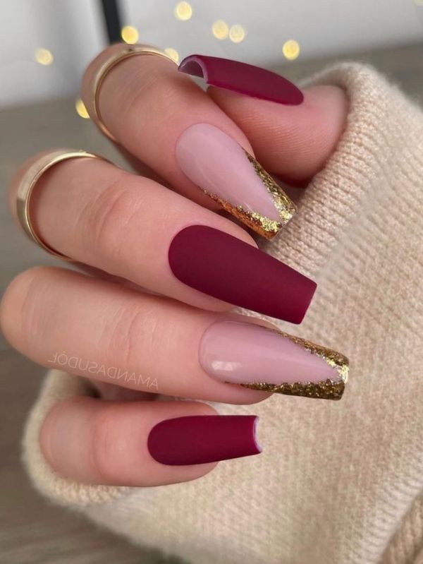 burgundy nails with gold triangle french tips