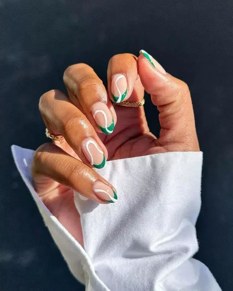 green and white nail art on almond nails swirl nails