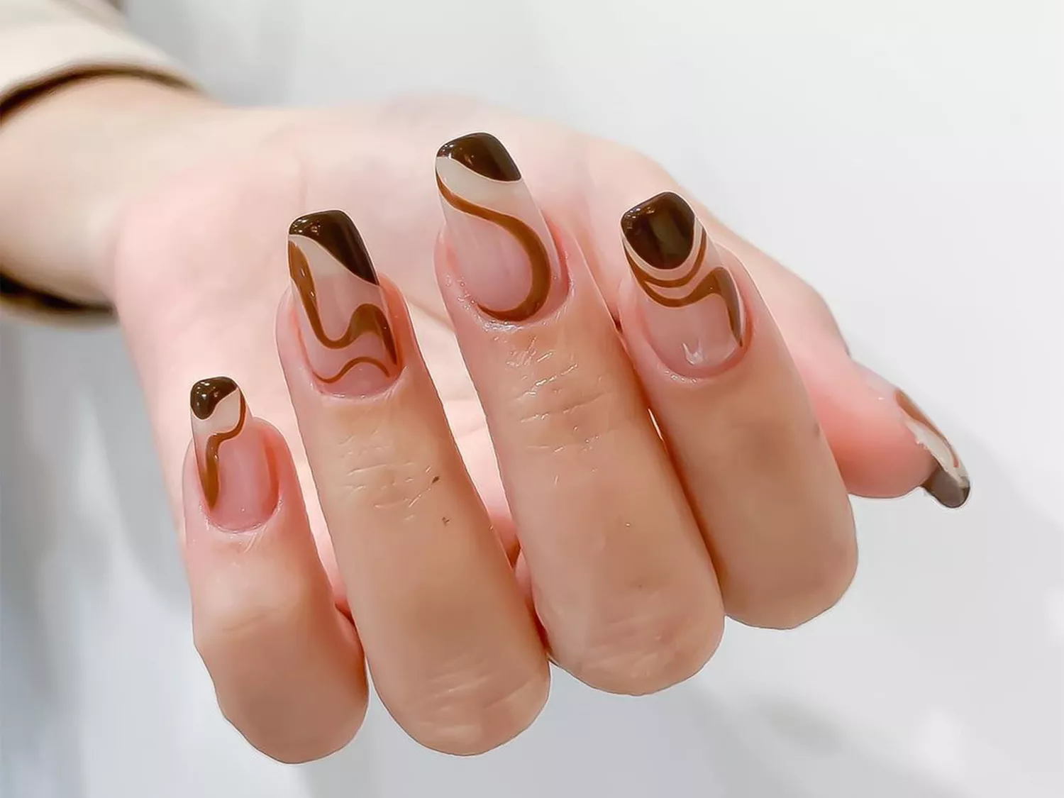 brown swirl manicure