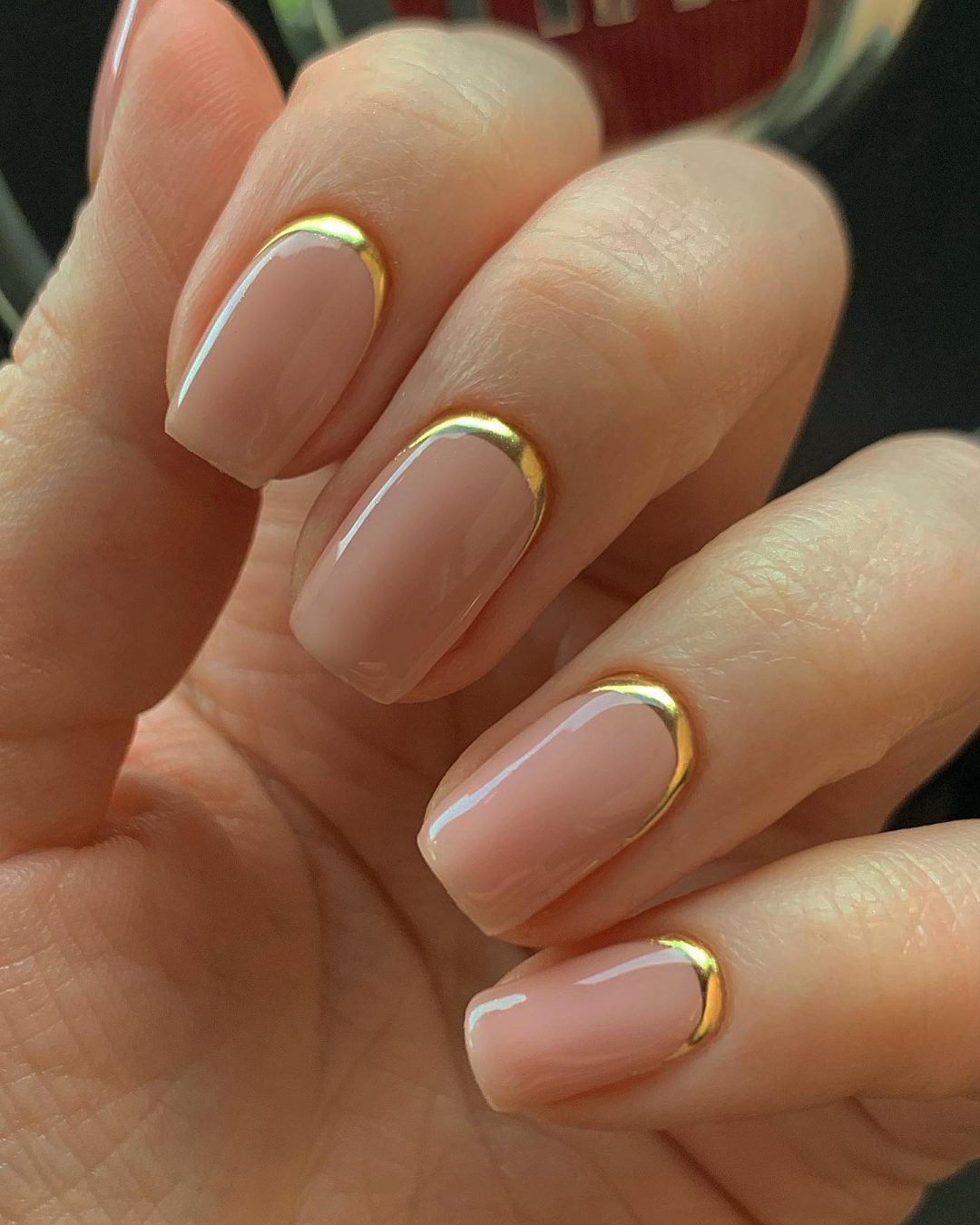 Short gold reverse French nails.