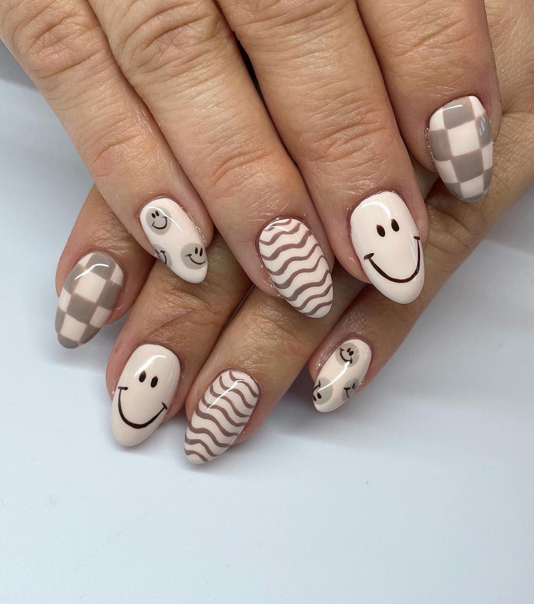 Taupe smiley nails.