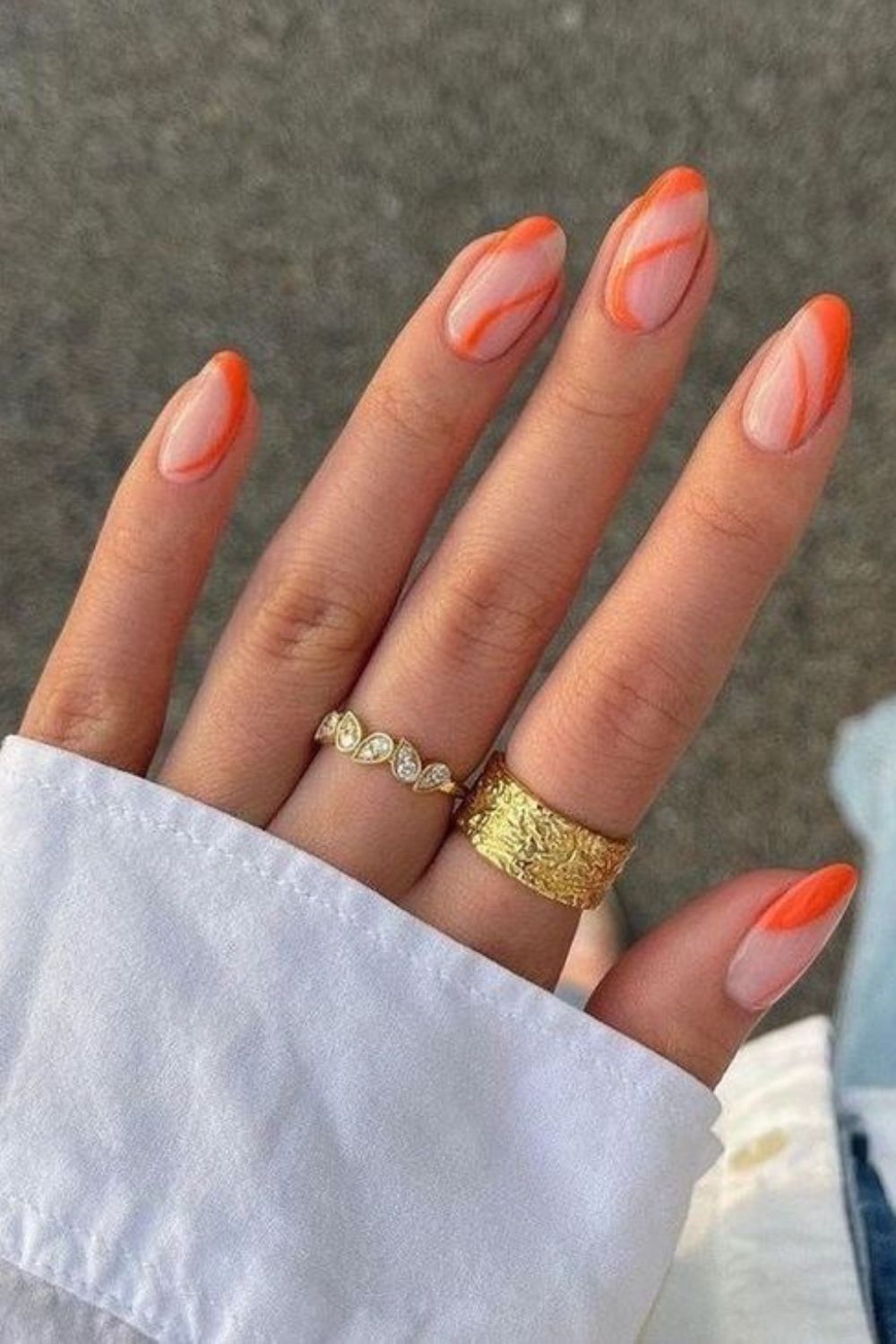 Orange swirl nails with clear base