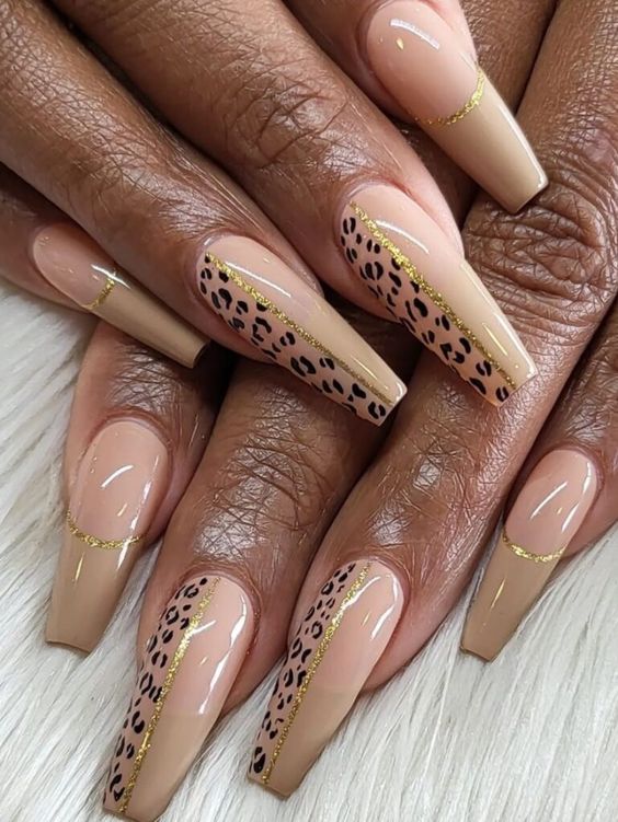 Animal print beige nails with gold lines