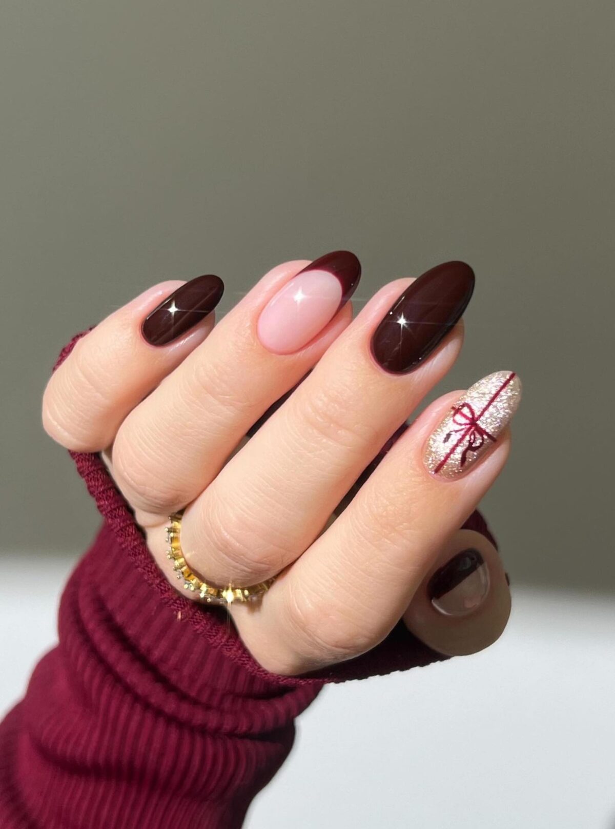 Burgundy and gold nails for Christmas.