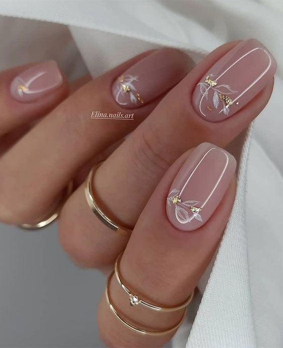 Clear nails with golds and leaves