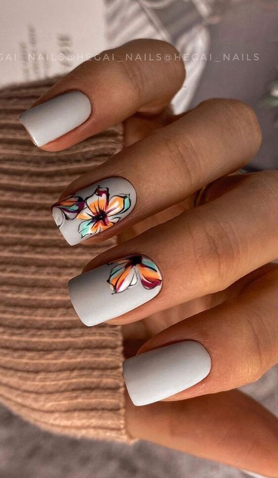 Matte light gray neutral square nails with colorful flowers