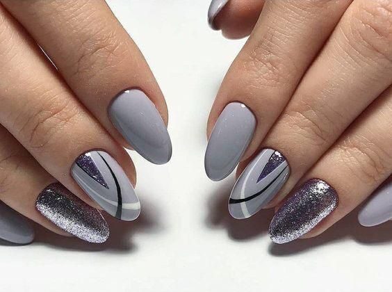 Glossy grey nails with lines and glitters