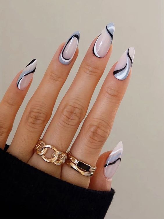 Almond neutral nails with gray, black, and white swirls