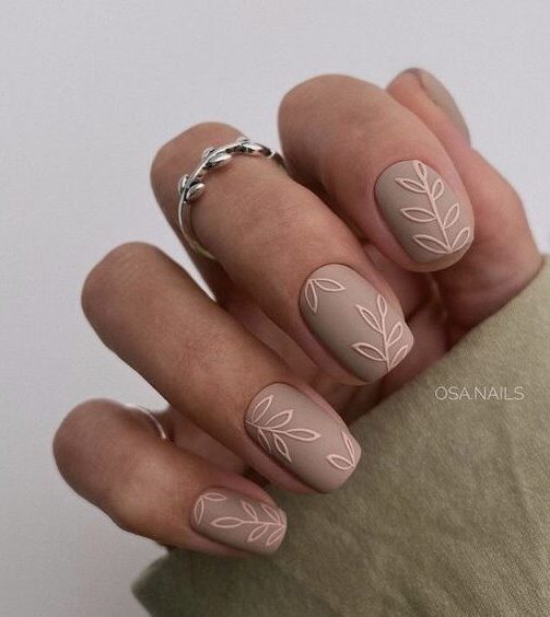 Short square taupe nails with leaves