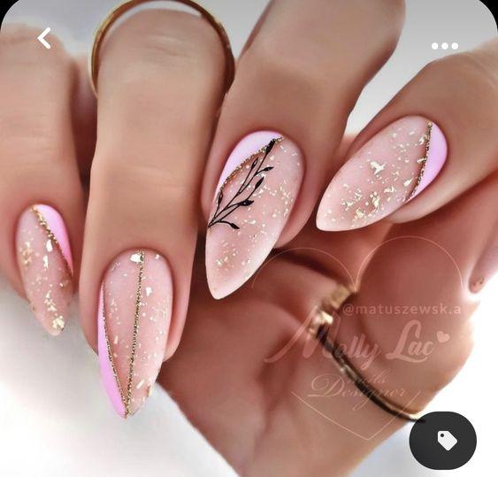 Nude pink almond nails with gold dusts