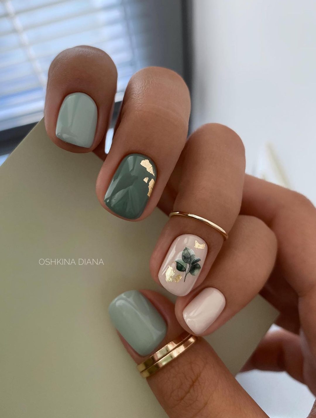 Short white and olive green nails.