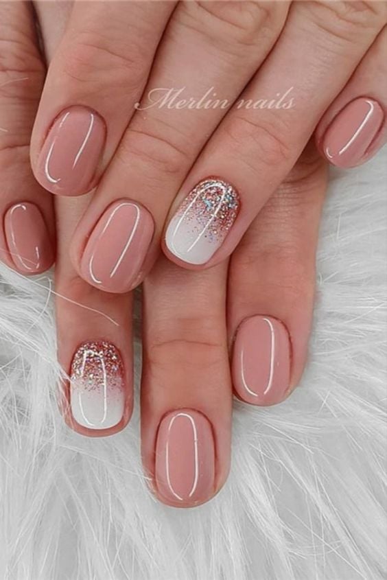 White and pink short nail designs with glitter.