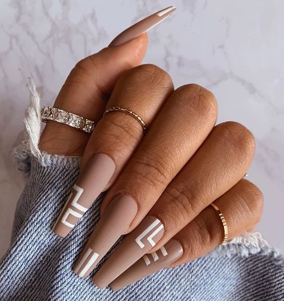 Beige coffin nails with white lines