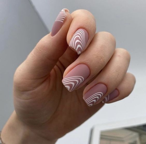 Geometric nail art on short nude nails