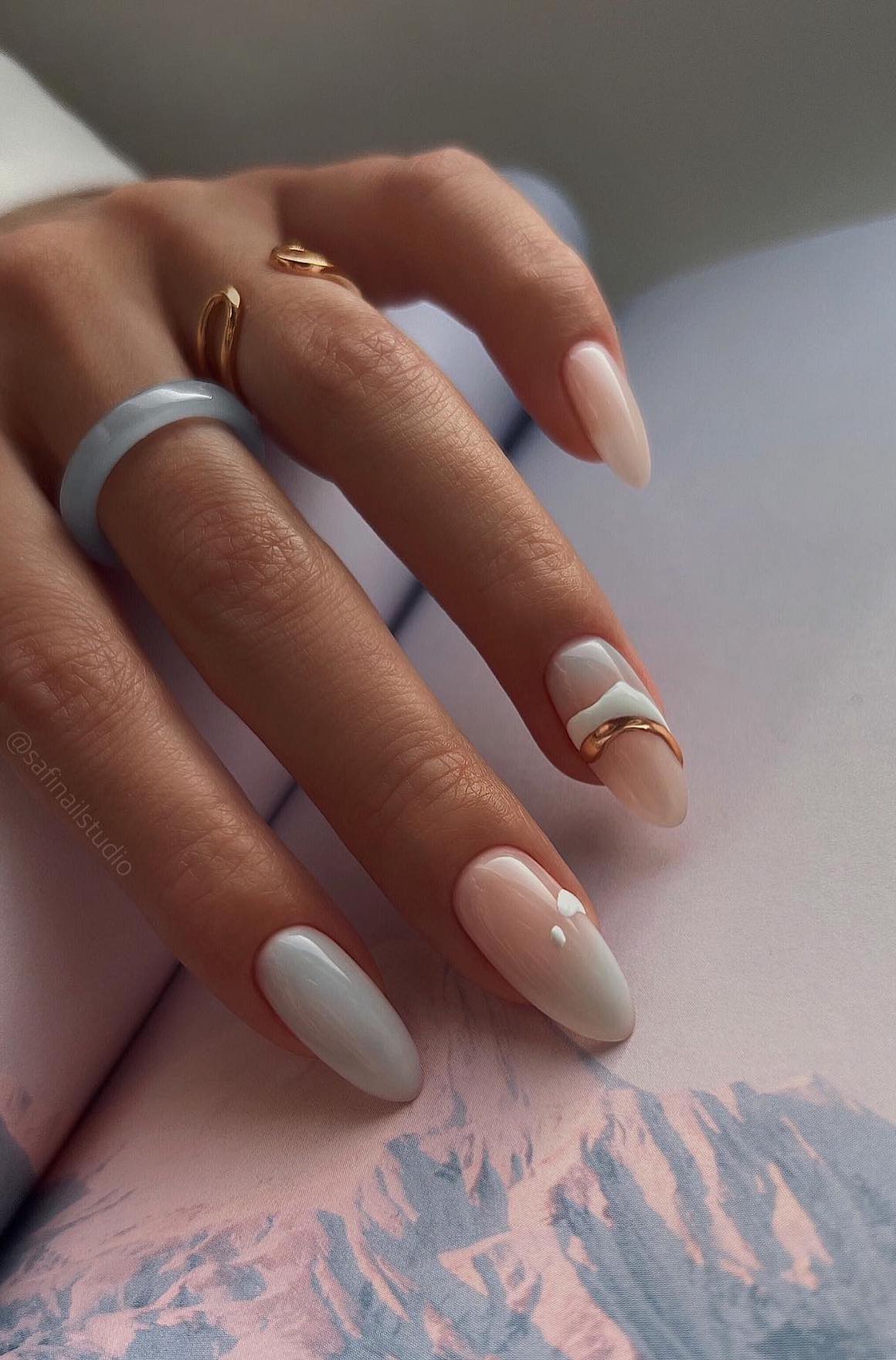 White milky nails in almond shape.