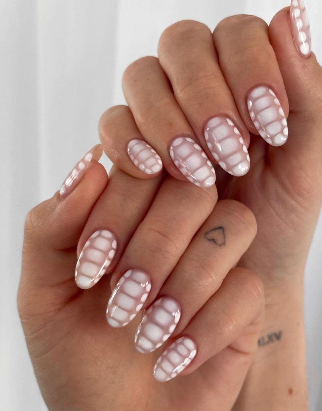 White crocodile print nails.