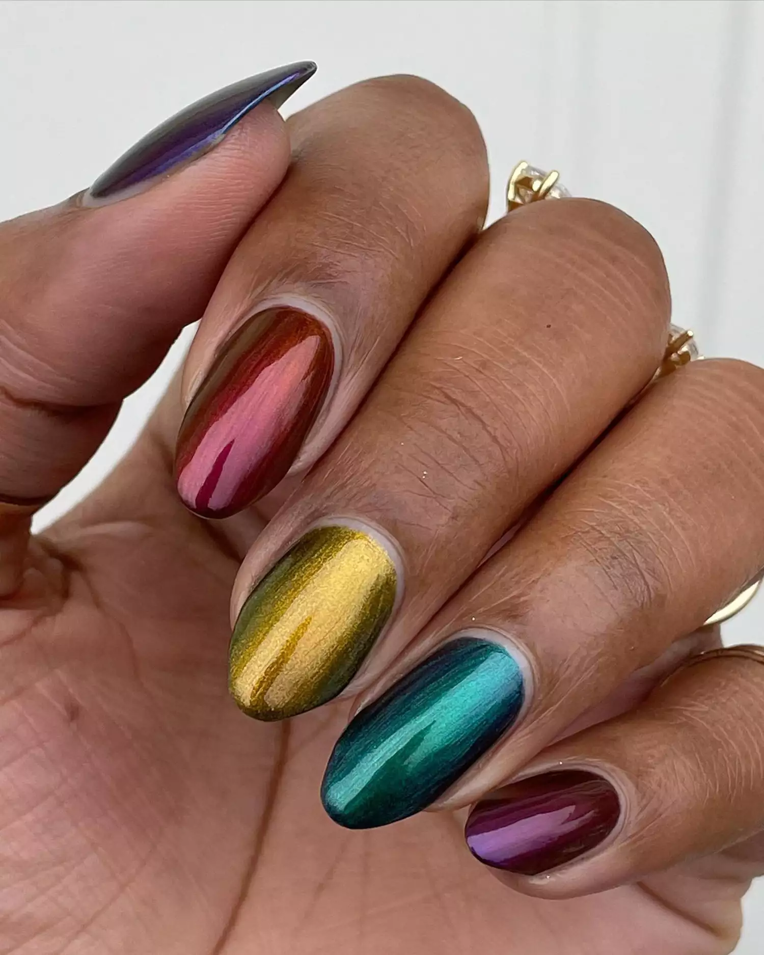 A jewel-toned chrome manicure