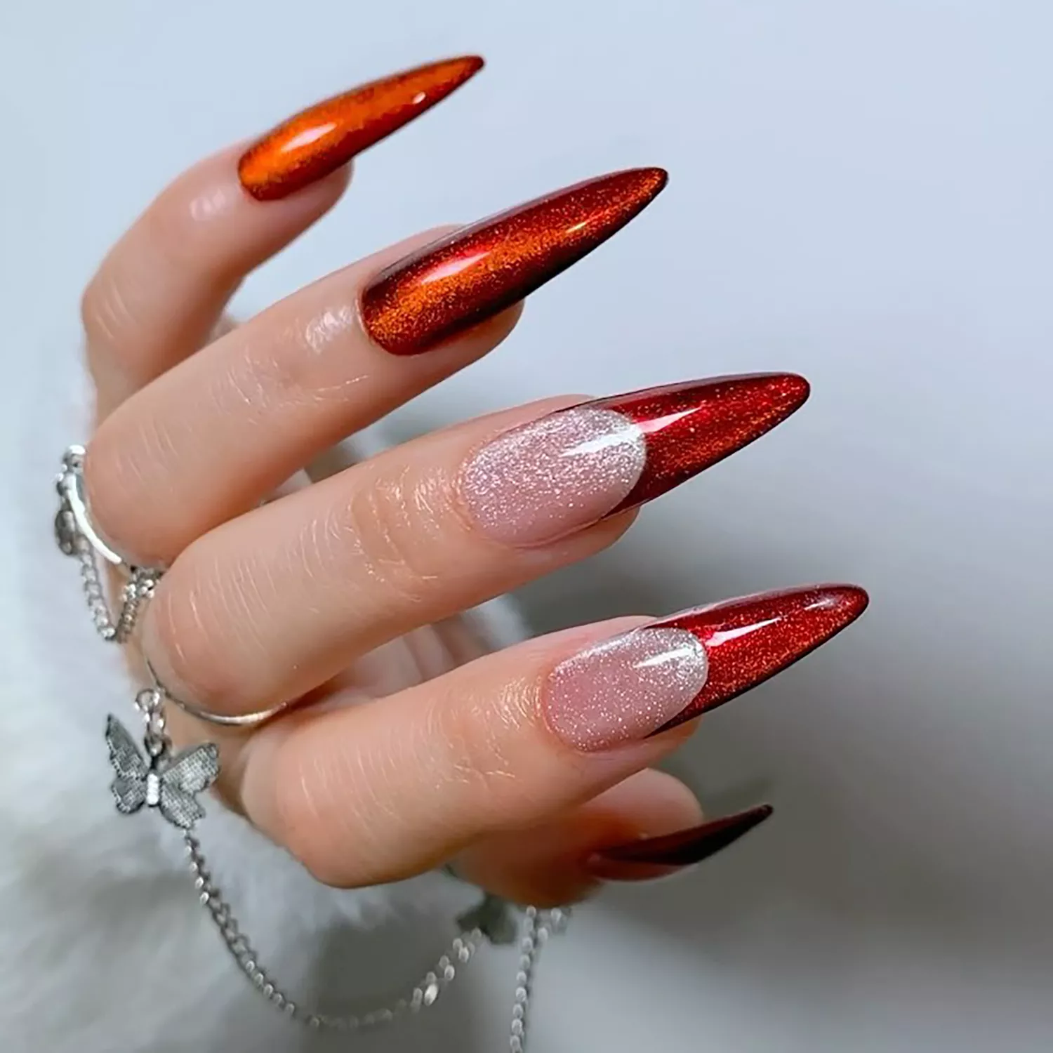 Red velvet stiletto manicure with a chrome base