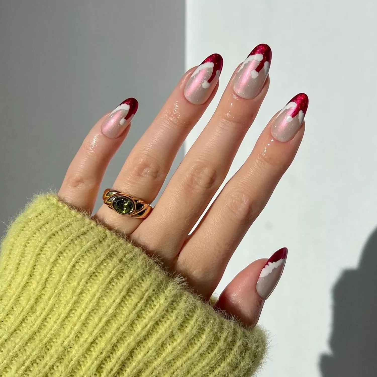 Close up of a chrome manicure with santa hat French tips